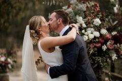 Emily & Chris Pfeiffer Wines Wedding, Rutherglen - Bride and groom kiss